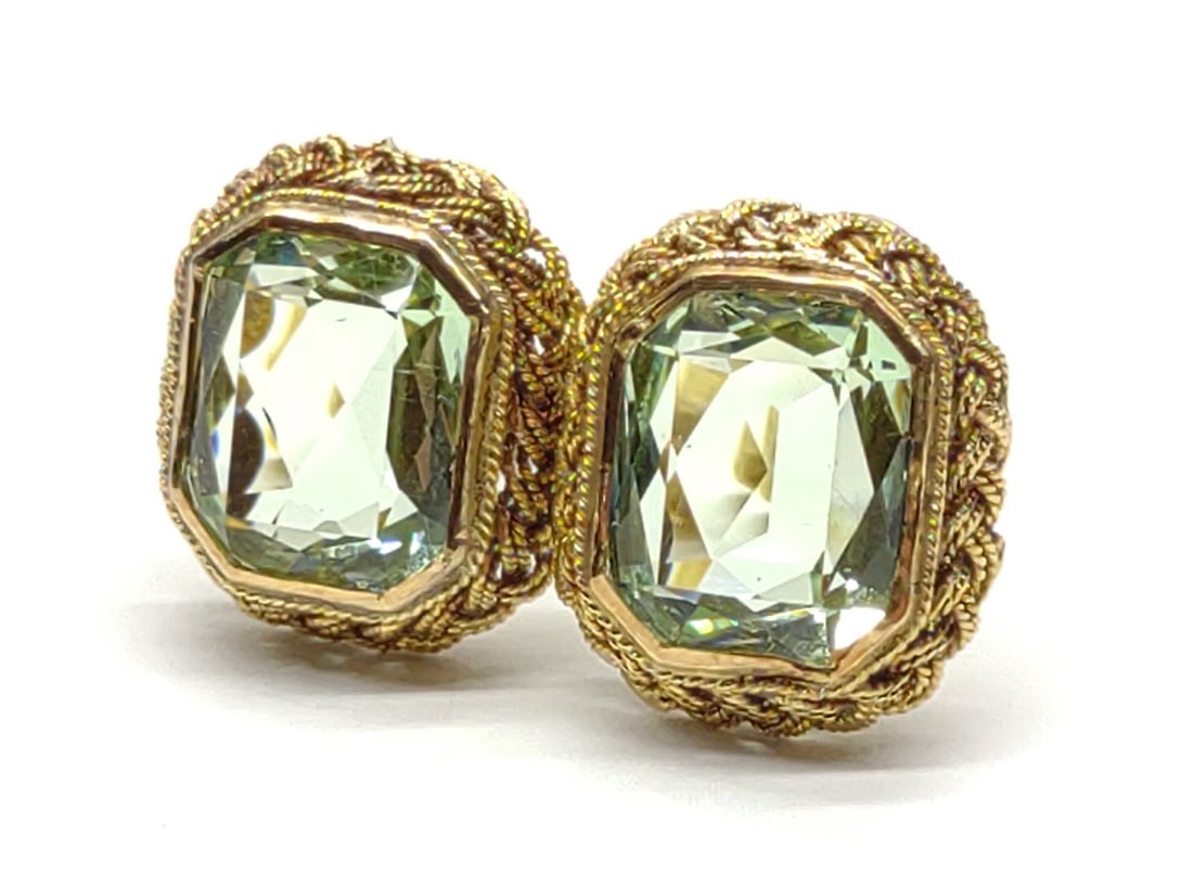 14K Gold & Green Feldspar Earrings: Pair of 14 karat yellow gold green cut orthoclase feldspar post earrings. Posts have locking hinged safety backings. Backing ends have illegible makers markings. Has been tested for gold purity and st