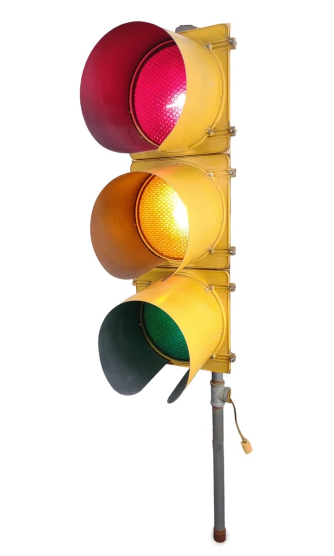 TCT Traffic Signal Light (Works): TCT traffic signal light, mounted on metal pole. Have been wired to standard exterior rated extension cord. Tested and working. All three lights work. Measures approx. 77 x 25 x 15 in. In-house intern