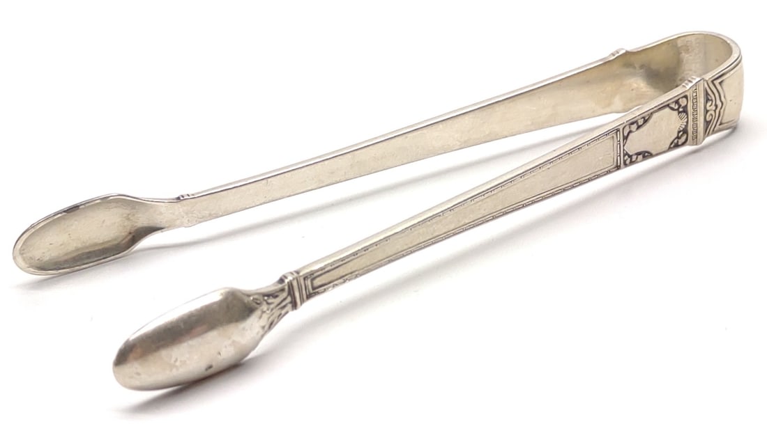 Tiffany & Co Sterling Silver Sugar Tongs: Vintage Tiffany & Co signed sterling silver sugar tongs. Marked "Tiffany & Co Sterling Pat 1916". No monograms. Has been tested for silver purity. Total weight: 23.44 grams. SHIPPING OPTIONS AVAILABLE