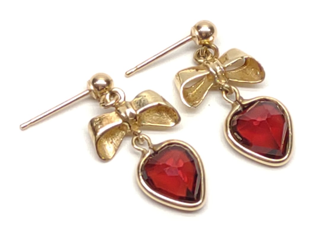 14K Gold Heart Garnet Bow Dangle Drop Earrings: Antique, 14 karat yellow gold and garnet dangle drop post earrings with tied bow / ribbons. Heart cut garnets, 8mm x 8mm. Unmarked. Has been tested for gold purity and stones. RI 1.756. Total weight: