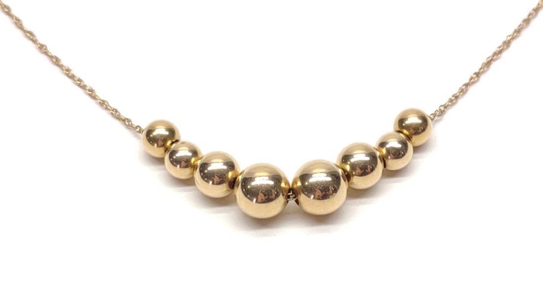 14K Yellow Gold 24" Beaded Twist Chain Necklace: Vintage 14 karat yellow gold twist chain necklace with 8 beaded ball accents. 24" long. 1mm wide chain. Clasp is marked "14K". Has been tested for gold purity. Total weight: 1.89 grams. SHIPPING OPTIO