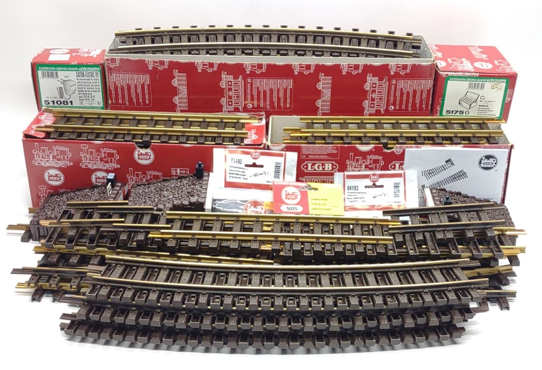 LGB G Gauge Train Track & Accessories: LGB G scale train track and accessories. Includes 1 box of 12 piece 16000 brass curve track, (2) boxes of 12 piece 10000 brass straight track, 51750 switch control Box with box, 51081 18V Transformer