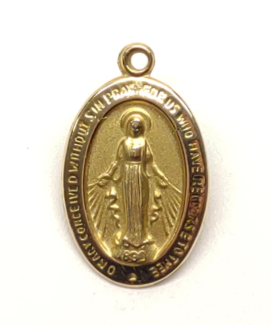 14K Gold Mother Mary Miraculous Medal Pendant: 14 karat yellow gold religious necklace pendant of Mother Mary. Backside of pendant is marked "14K". Has been tested for gold purity. Total weight: 0.85 grams. SHIPPING OPTIONS AVAILABLE: UPS 'Pack