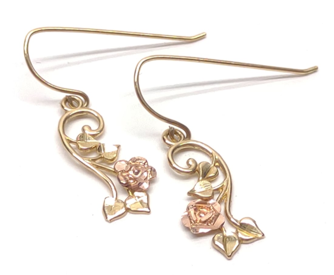 10K Gold Michael Anthony Rose Drop Earrings: Pair of 10 karat yellow and rose gold floral drop earrings. Features pink rose with yellow gold stem and leaves. Marked "Ma 10K" on post (Michael Anthony). Has been tested for gold purity. Total weigh