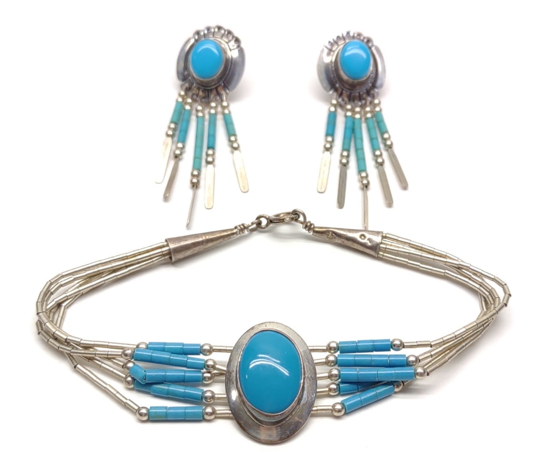 Turquoise Sterling Silver Earrings & Bracelet Set: A vintage sterling silver and turquoise beaded bracelet (7" long) and dangle earring set. Backside of earrings are marked "OTC" and "Sterling". Bracelet is marked "Sterling". Both have been tested for