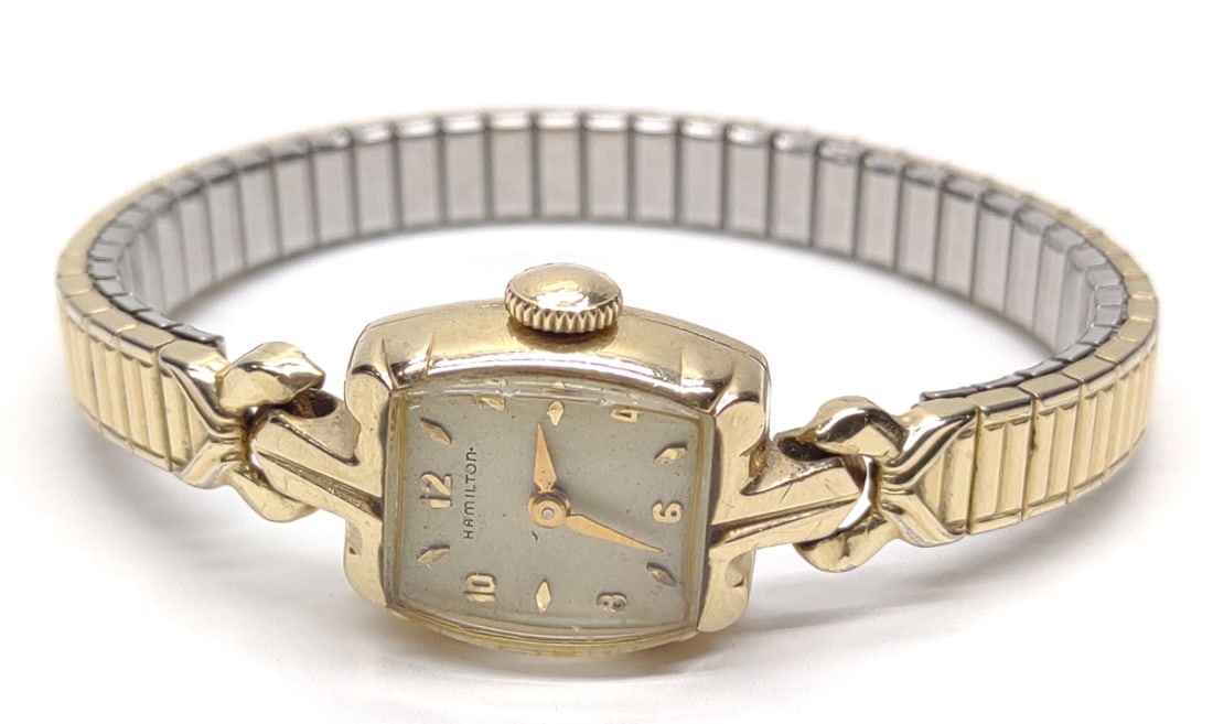 Hamilton 10K Yellow Gold Ladies Wrist Watch: Vintage Hamilton 10 karat yellow gold ladies wrist watch. Tested and works. Body of watch is 10K gold, band is plated. Exterior of watch case is marked "Hamilton 10K Gold". Inner case is marked "Sonya