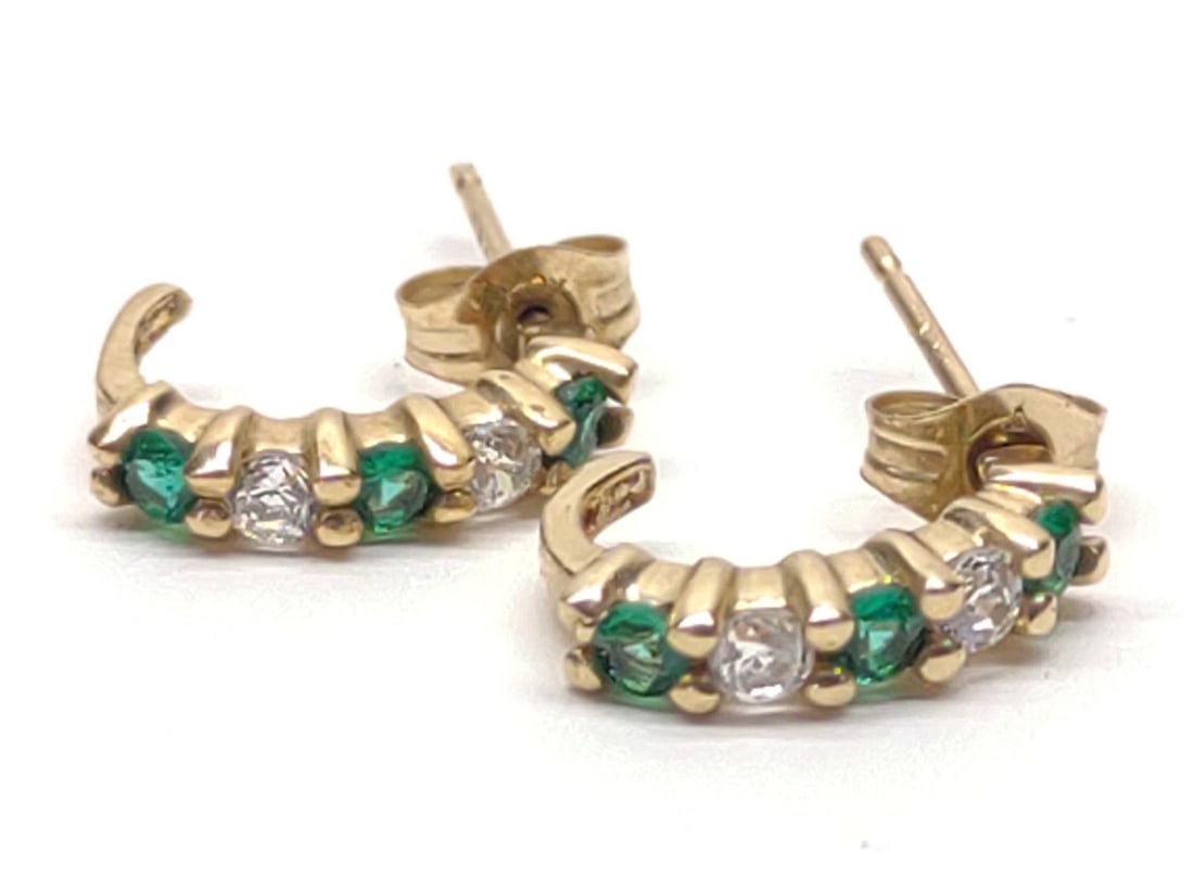 10K Gold Green & Clear Stone Earrings: Pair of 10 karat yellow gold half hoop earrings with green and clear stones (not diamonds). Posts are unmarked, backings are marked "10K". Both have been tested for gold purity. Total weight: 0.96 gra