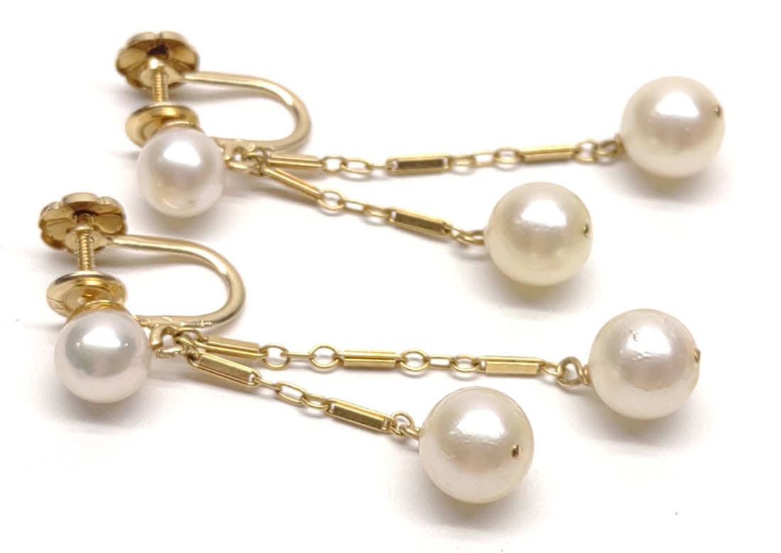 14K Gold 7mm Pearl Screw Back Clip Dangle Earrings: Pair of vintage 14 karat yellow gold screw-back clip earrings with 7mm pearls on a dangle style chain. Marked "14KT". Has been tested for gold purity and pearls. Total weight: 3.92 grams SHIPPING OPTI