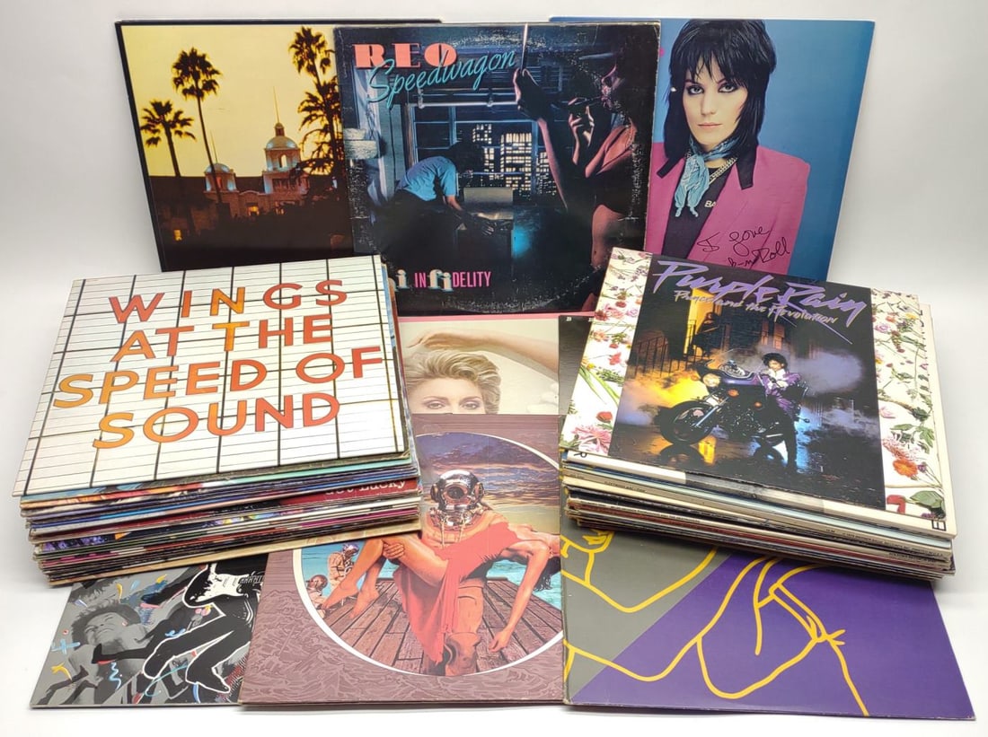 53 Classic Rock Vinyl Record Albums: 53 Classic Rock vinyl record albums including Eagles: Hotel California, 2 REO Speed Wagon: Hi Infidelity, Joan Jet & The Blackhearts: I Love Rock 'N' Roll, Bryan Adams: Reckless, Olivia Newton-John: G