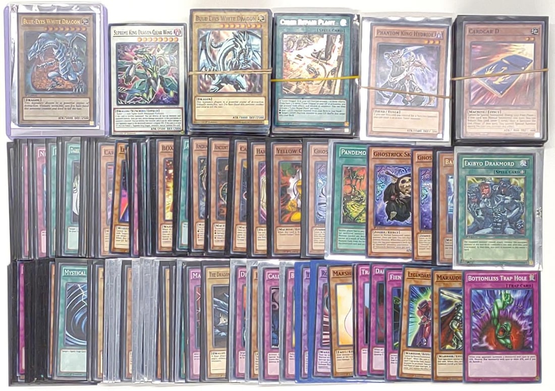(229) Yu-Gi-Oh Trading Cards (Incl. 1st Ed.): (229) Yu-Gi-Oh trading cards. Some cards include SDBE-EN001 Blue-Eyes White Dragon 1st Edition foil, LEDD-ENC30 Supreme King Dragon Clear Wing 1st Edition, MP14-EN203 Ghostrick Mary 1st Edition, SR03-