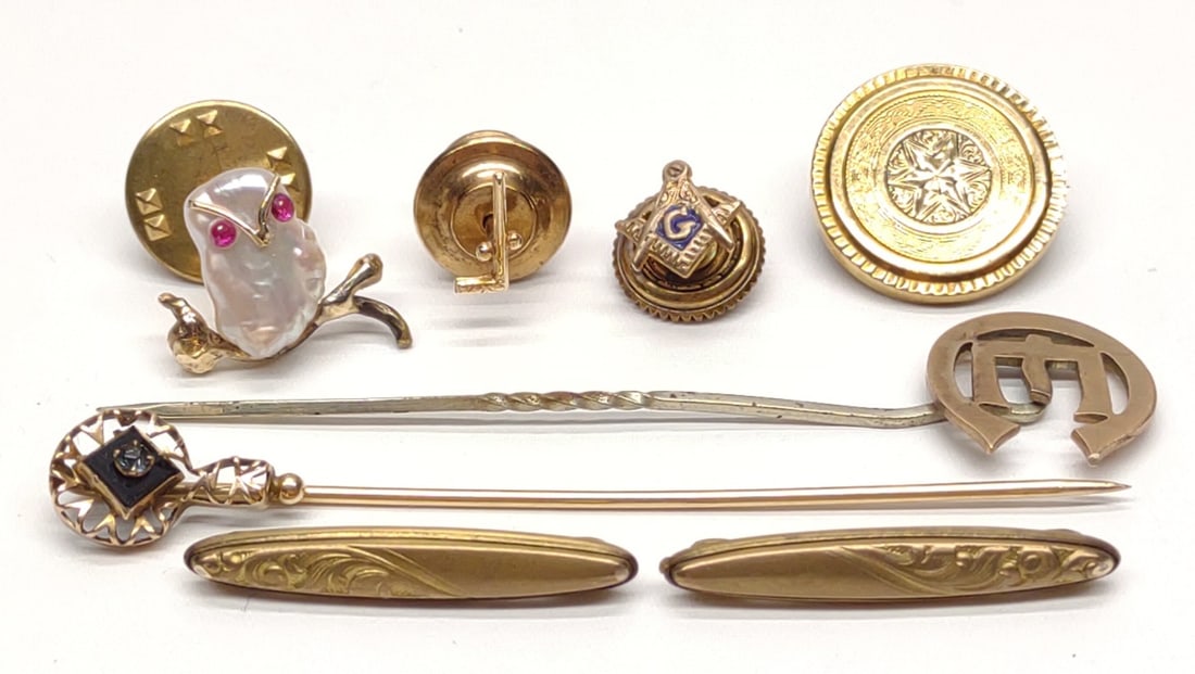 (8) 14K & 10K Gold Pins & Stickpins: A group of 14 karat and 10 karat yellow gold pins and stickpins. Includes 14k freshwater pearl and ruby owl pin (marked "14K"), 14k putter golf club pin (marked "14K", needle is not gold), two vintage