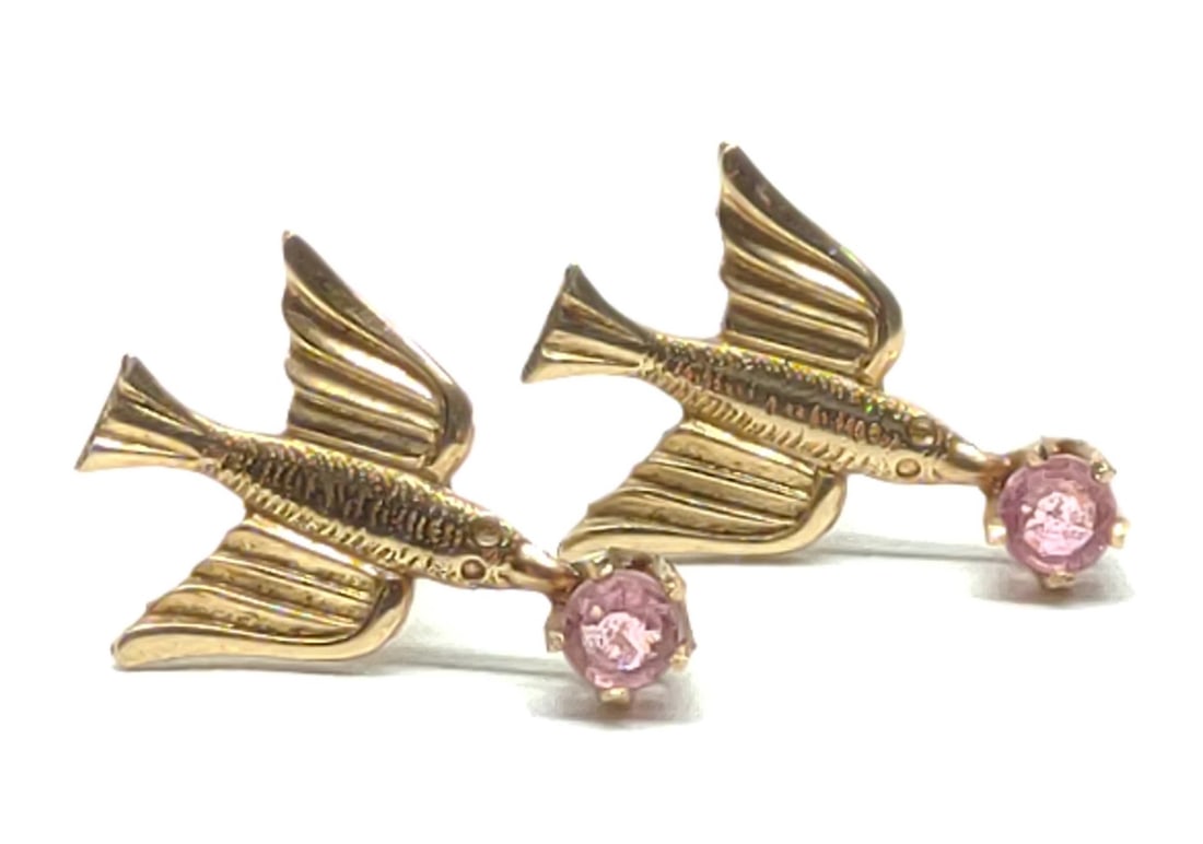 Antique 10K Flying Bird Screw Back Post Earrings: Pair of antique 10 karat yellow gold flying bird screwback post earrings with pink accent stone. Backings are marked "10K" with makers mark "BDA" (Budlong Docherty and Armstrong). Has been tested for