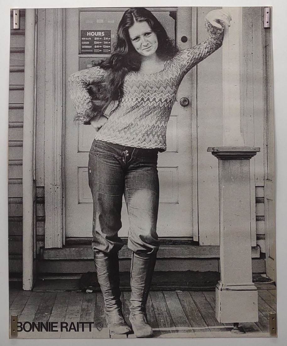 Bonnie Raitt Warner Bros Promotional Poster 26x21": Vintage Bonnie Raitt Warner Brothers promotional record store advertising poster. Printed on heavy stock board. Displays Warner Brothers logo on lower left margin. Poster measures approx. 26 1/2 x 21