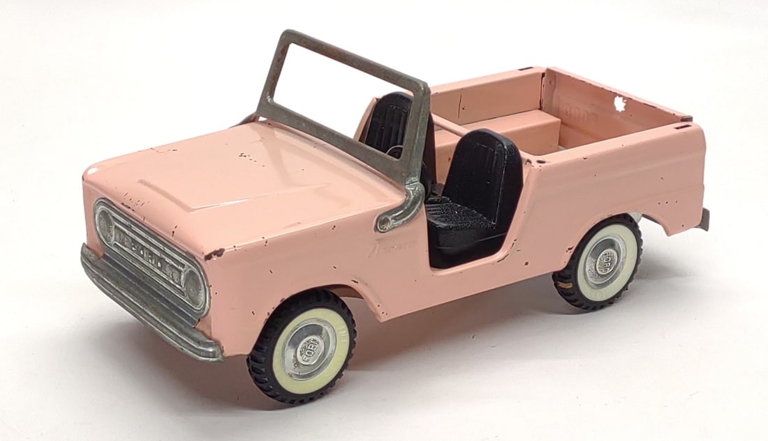 Vintage Nylint Pink Ford Bronco Pressed Steel Toy: Vintage Nylint Ford Bronco pressed steel toy in pink. Missing tailgate's spare tire. Paint is good. Underside is marked "Nylint Toys". Toy measures approx. 11 1/4 x 5 x 5 in. SHIPPING OPTIONS AVAILABL