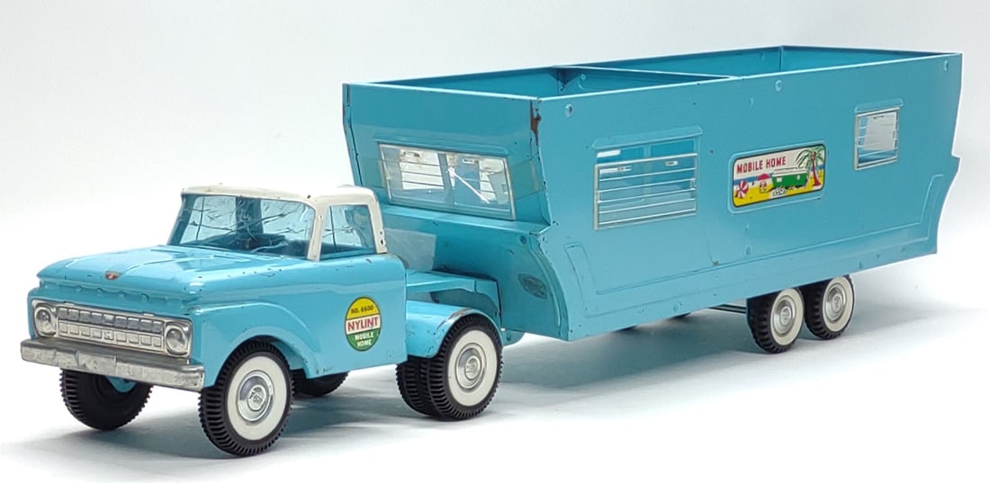 1960s Nylint No. 6600 Toy Truck & Mobile Home: Vintage, 1960s, pressed steel Nylint Mobile Home. #6600. Missing trailer roof. Toy measures approx. 29" long total. Trailer measures approx. 21 x 6 x 7 in. SHIPPING OPTIONS AVAILABLE: UPS 'Pack & Ship
