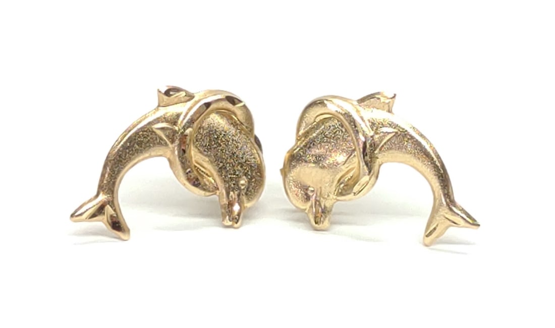 14K Yellow Gold Dolphin Post Earrings: Pair of 14 karat yellow gold dolphin jumping through hoop earrings. Posts are marked "14K S", and backings are marked "14K". Both have been tested for gold purity. Total weight: 0.34 grams. SHIPPING O