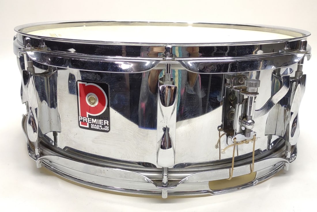 Vintage Premier 1005 Chrome Snare Drum 14" x 5.5": Vintage Premier 14" x 5.5" chrome 8 lug snare drum model: 1005. Includes bottom half of snare stand (does not include top stand rest), and original Premier hard case. Snare badge serial number: 08807.