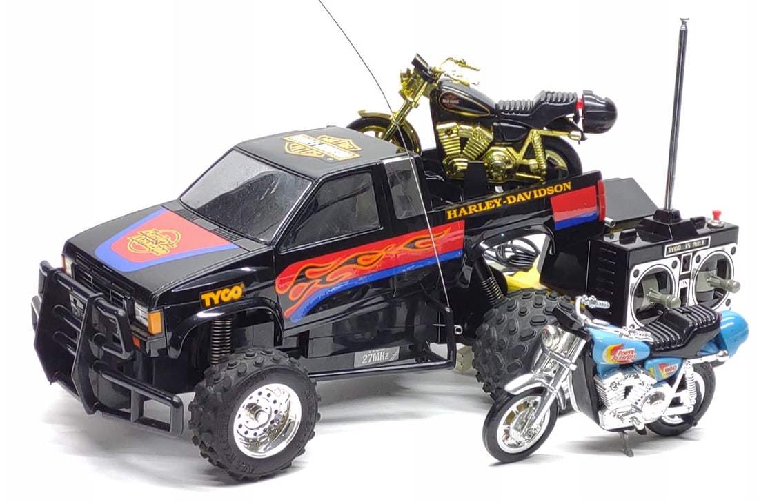 Tyco R/C 9.6V Turbo Harley Davidson Truck (Works): Vintage 1992 Tyco R/C Harley Davidson toy truck with golden motorcycle and extra motorcycle. Includes Harley Davidson r/c truck, Harley Davidson pullstring diecast motorcycle, Matchbox Power Blasters