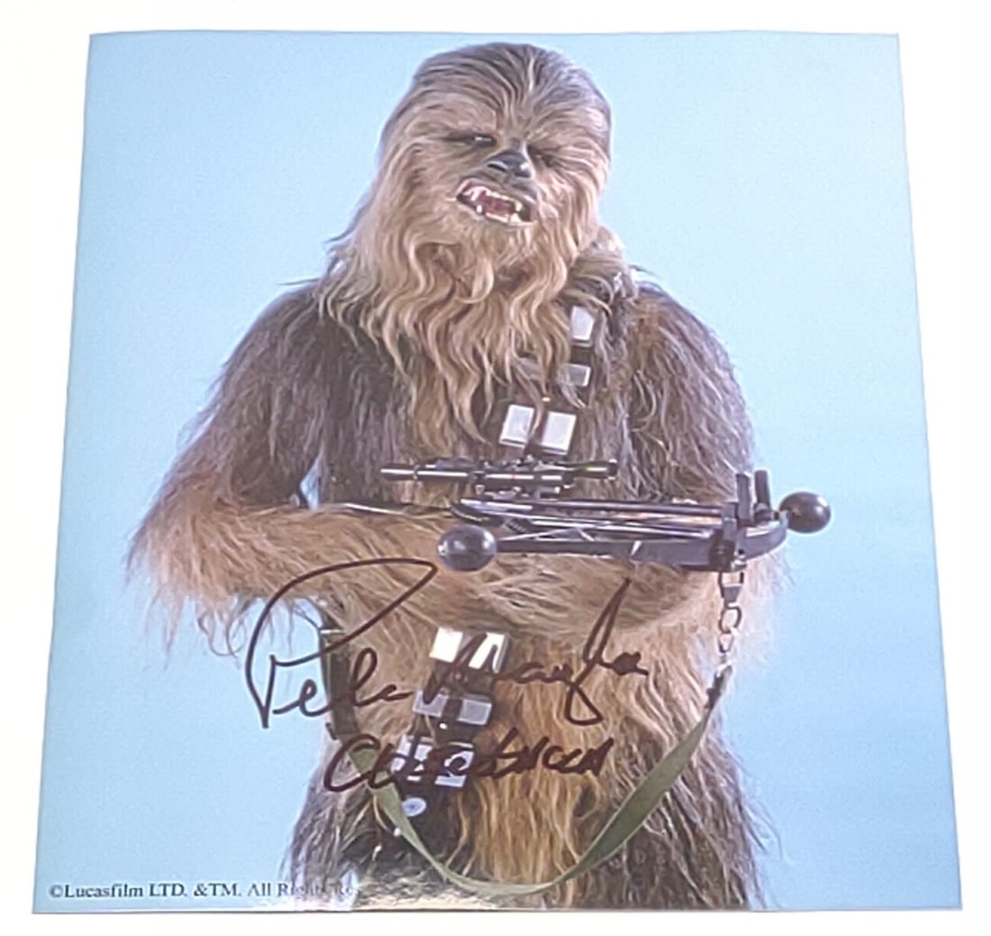 Peter Mayhew Signed Chewbacca Star Wars Photograph: Peter Mayhew autographed Star Wars Chewbacca photograph. Photograph measures approx. 8 x 10 in. Includes COA from exclusivesignings.com SHIPPING OPTIONS AVAILABLE: UPS 'Pack & Ship' or LiveShipping. I