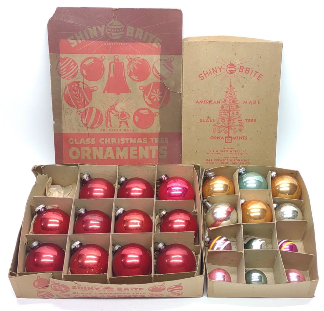 23 Vintage Shiny Brite Christmas Ornaments & Boxes: 23 Vintage Shiny Brite glass Christmas tree ornaments with 2 Shiny Brite boxes. Includes various sized round glass ornaments, some with mid century stripe pattern. Largest box measures approx.13 x 10