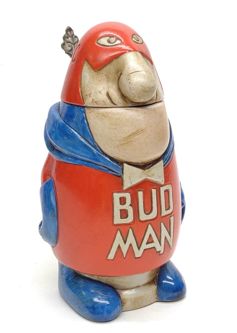 1975 Budweiser Bud Man Advertising Beer Stein CS-1: Vintage 1975 Anheuser Busch Budweiser first edition Bud Man lidded beer stein. CS-1 with hollow head lid. Underside is marked "Ceramarte Made In Brazil". No chips or cracks. Measures approx. 7 1/2 x 6