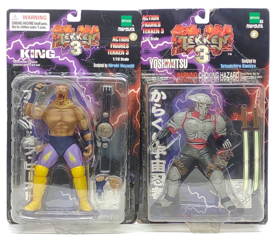 2 Epoch Tekken 3 Yoshimitsu & King Action Figures: (2) Vintage late 1990s Epoch Tekken 3 1/10 scale action figure toys sealed in original blister packs. Includes King and Yoshimitsu action figures. Each blister pack measures approx. 13 x 8 x 3 in. 