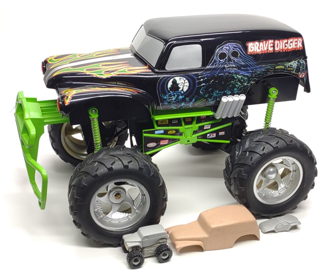 Pre-Production Tyco R/C Grave Digger Design Sample: Vintage Tyco RC pre-production Monster Jam Grave Digger design sample r/c truck. Includes large Grave Digger design sample, small Grave Digger prototypes, Grave Digger solid pattern casting, and small