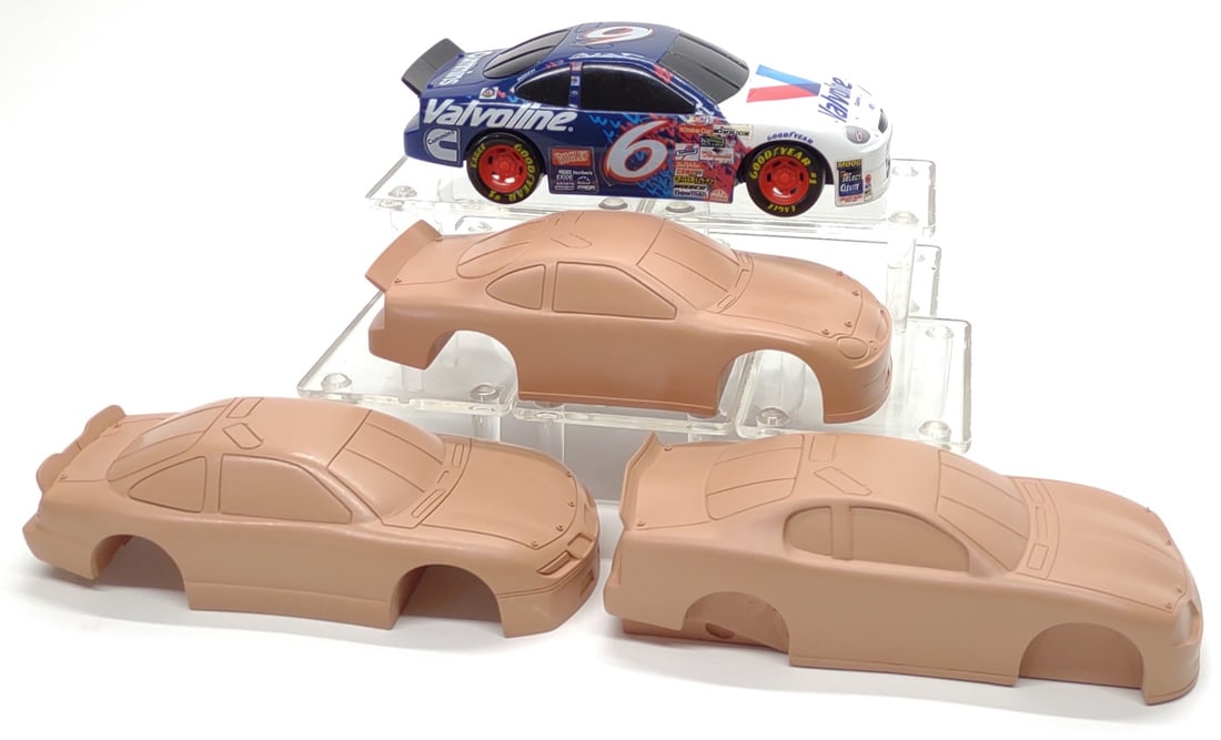 Pre-Production Tyco RC Canned Heat Nascar Toy Cars: Vintage Tyco R/C pre-production Ford Taurus Nascar Canned Heat toy cars and patterns. Includes test shot car and 3 solid pattern casting shells. Car is tested and working, moves forward, reverse and s