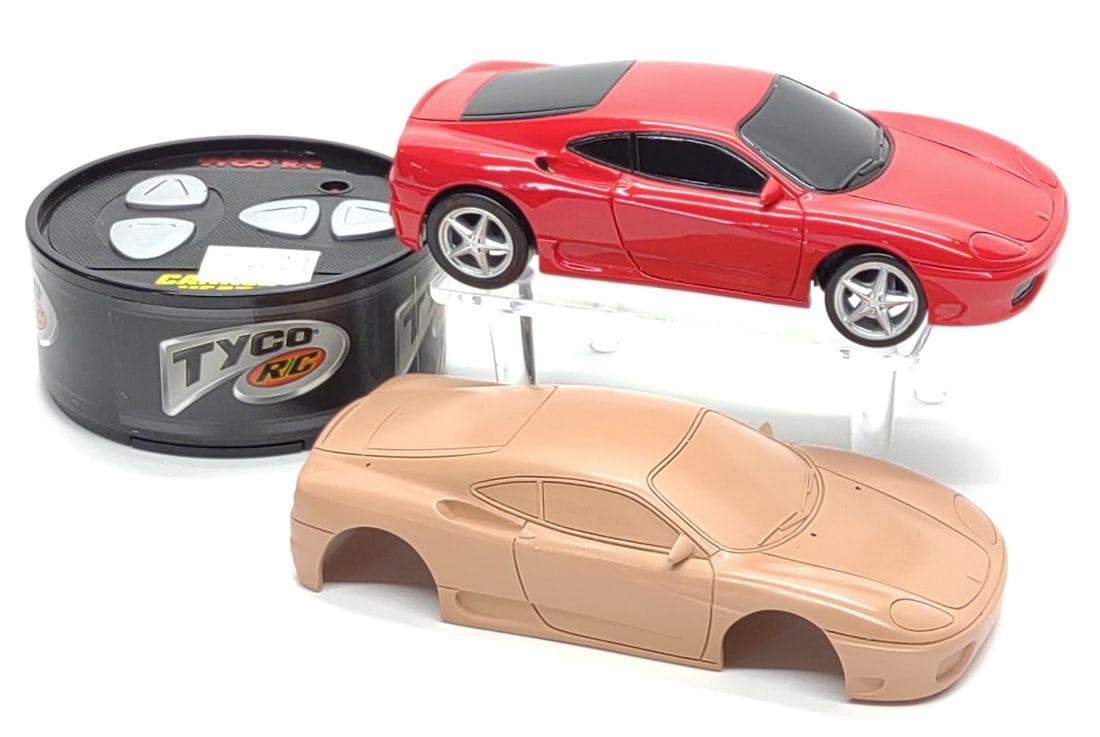 Pre-Production Tyco RC Canned Heat Ferrari Toy Car: Vintage Tyco R/C preproduction Ferrari Canned Heat RC toy car. Includes test shot car, sample controller and pattern casting shell. Toy car measures approx. 5 1/2 x 2 1/2 x 1 1/2 in. From private coll