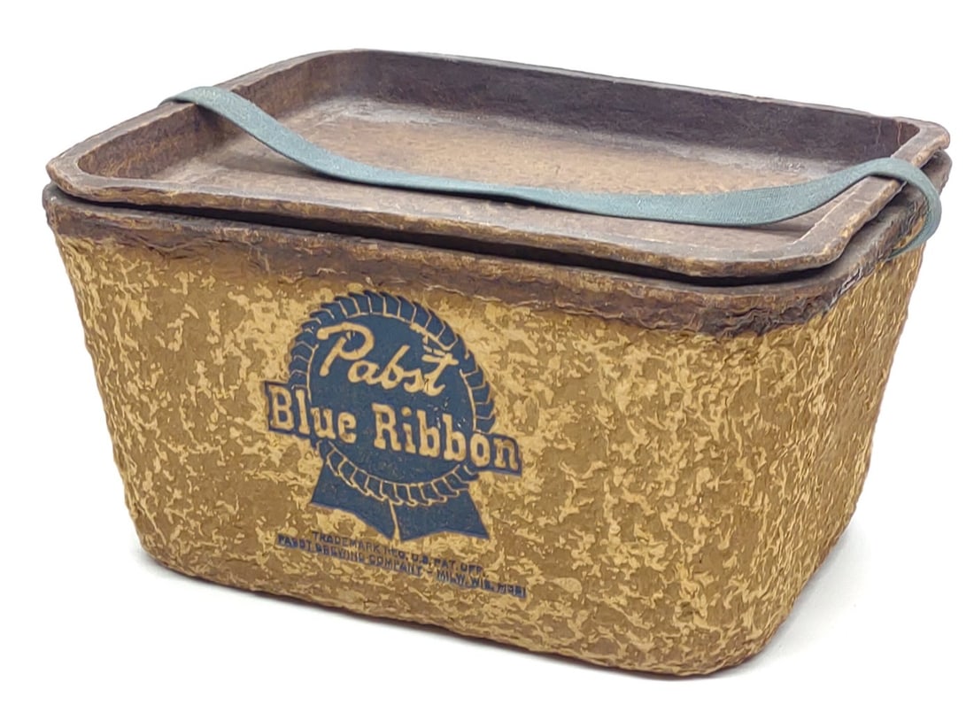 1950s Pabst Blue Ribbon Beer Paperboard Cooler: Vintage 1950s Pabst Blue Ribbon beer cardboard advertising cooler with lid, and fabric carry handle. Cooler is marked "Pabst Brewing Company Milw. Wis." on lower portion of front of cooler. Cooler mea