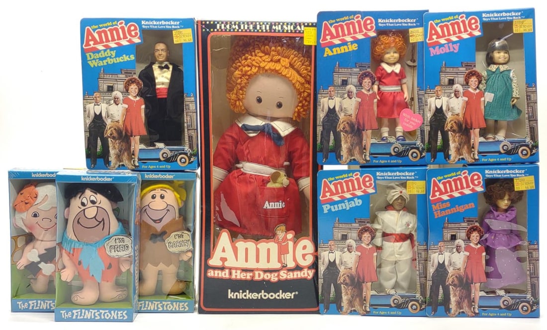 9 Knickerbocker Annie & Flintstones Dolls w/ Boxes: 9 vintage Knickerbocker Annie and Flintstones doll toys. Includes Annie 18" soft rag doll, Annie 6" figure, Molly, Miss Hannigan, Daddy Warbucks, Punjab, Fred Flintstone, Barney Rubble, and Bam Bam do