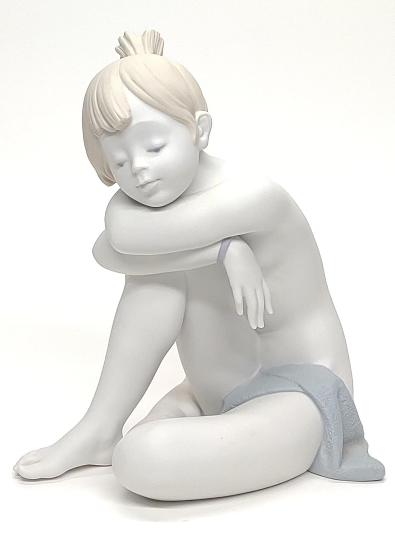 Lladro 6338 Im Sleepy Porcelain Figurine of Girl: Lladro porcelain figurine #6338. Sculpture titled I'm Sleepy. Features child girl falling asleep while resting head on knee. Number 01016338, matte finish. Year Retired: 2000. Underside is marked with
