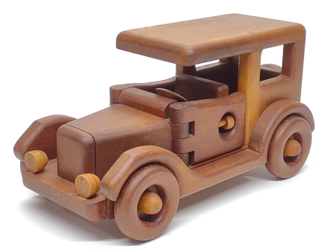 13" Handmade Ford Model T Wooden Toy Car Model: Vintage, 13" long Ford Model T model toy car. Signed "MHT" and dated 1970. Measures approx.: 13 x 6 1/2 x 6 1/2 in. SHIPPING OPTIONS AVAILABLE: UPS 'Pack & Ship' or LiveShipping. In-house shipping ava