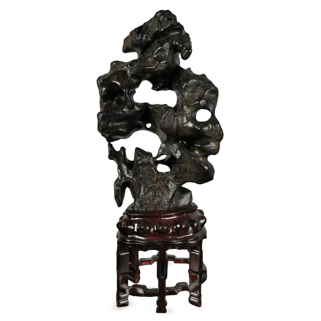 A CHINESE TAIHU SCHOLAR'S STONE ON STAND (1 of 8)