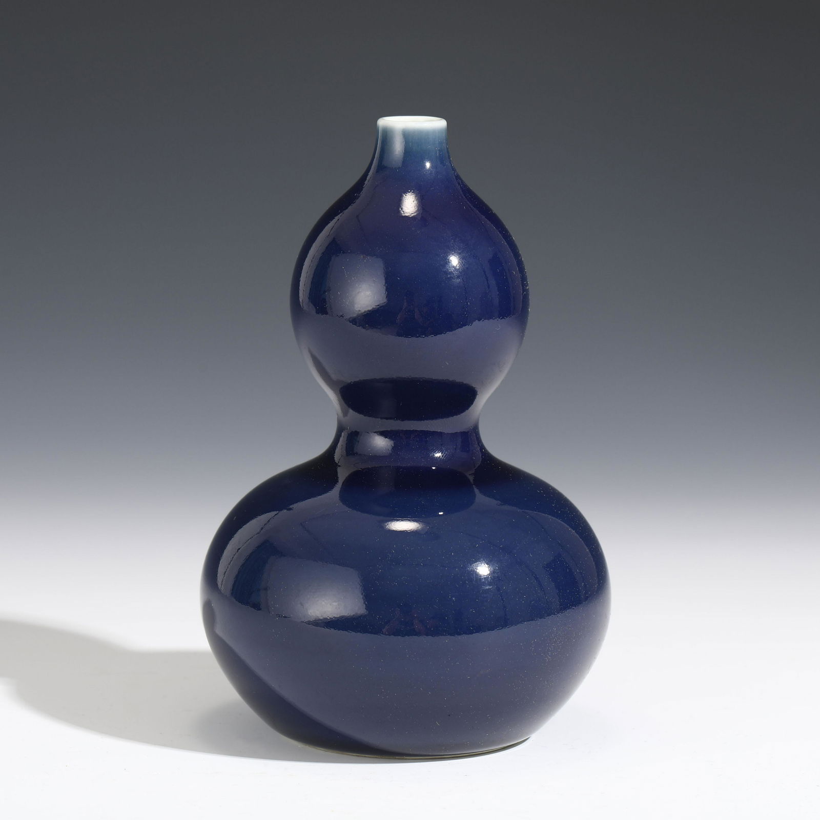 A CHINESE BLUE GLAZED PORCELAIN DOUBLE-GOURD VASE (1 of 8)