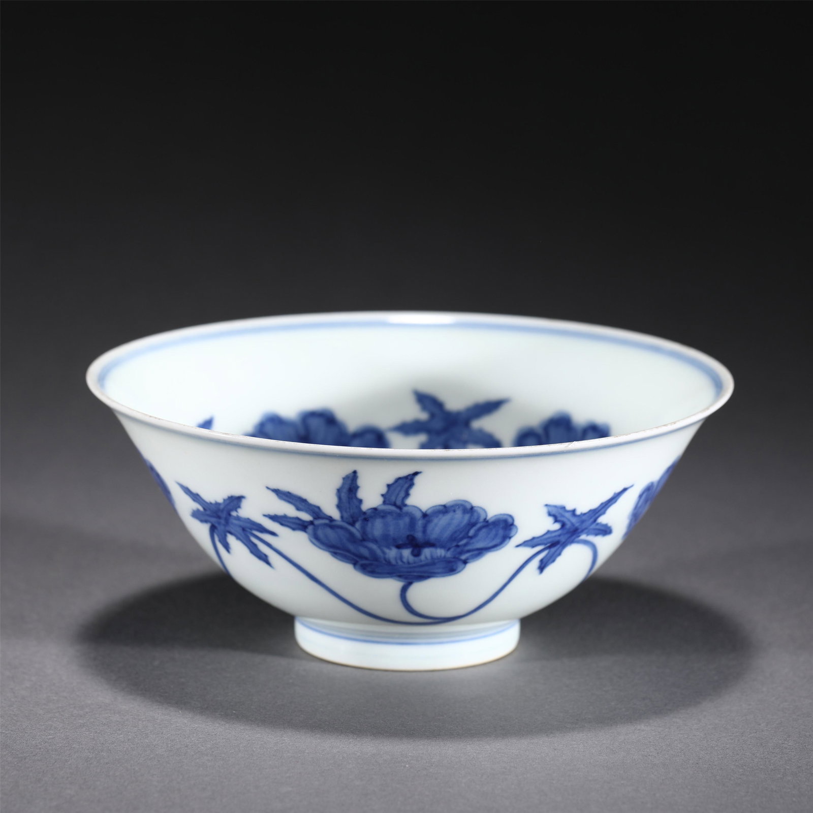 A BLUE AND WHITE PORCELAIN BOWL: A BLUE AND WHITE PORCELAIN BOWL With steep rounded sides rising to a gently flared rim, painted sprays in cobalt blue. DIMENSIONS: Diam. 15.5 cm. H. 6.5 cm. Weight 160 grams. HAVE A SIMILAR ITEM TO SE