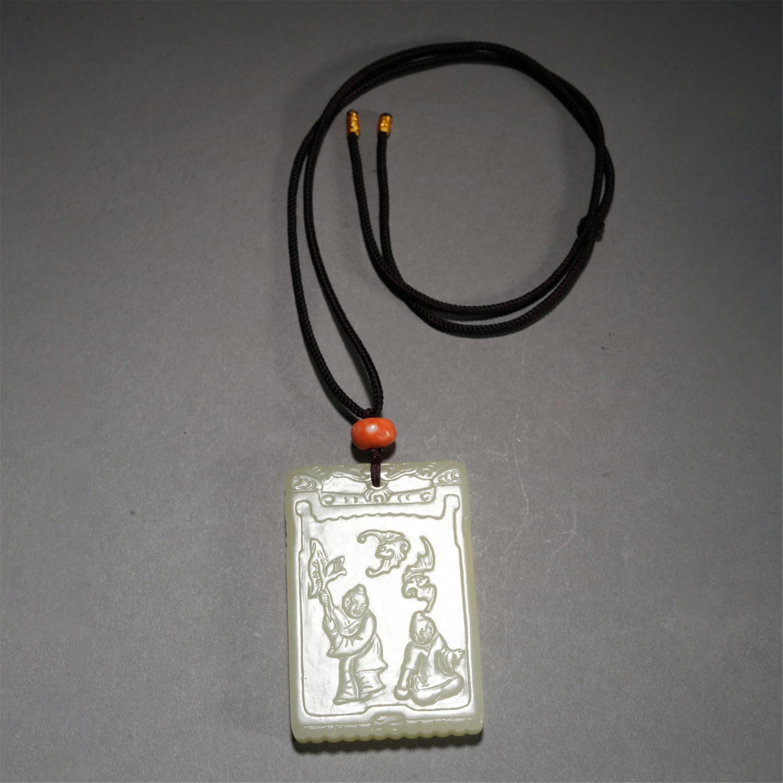 A CHINESE CARVED WHITE JADE PLAQUE (1 of 7)