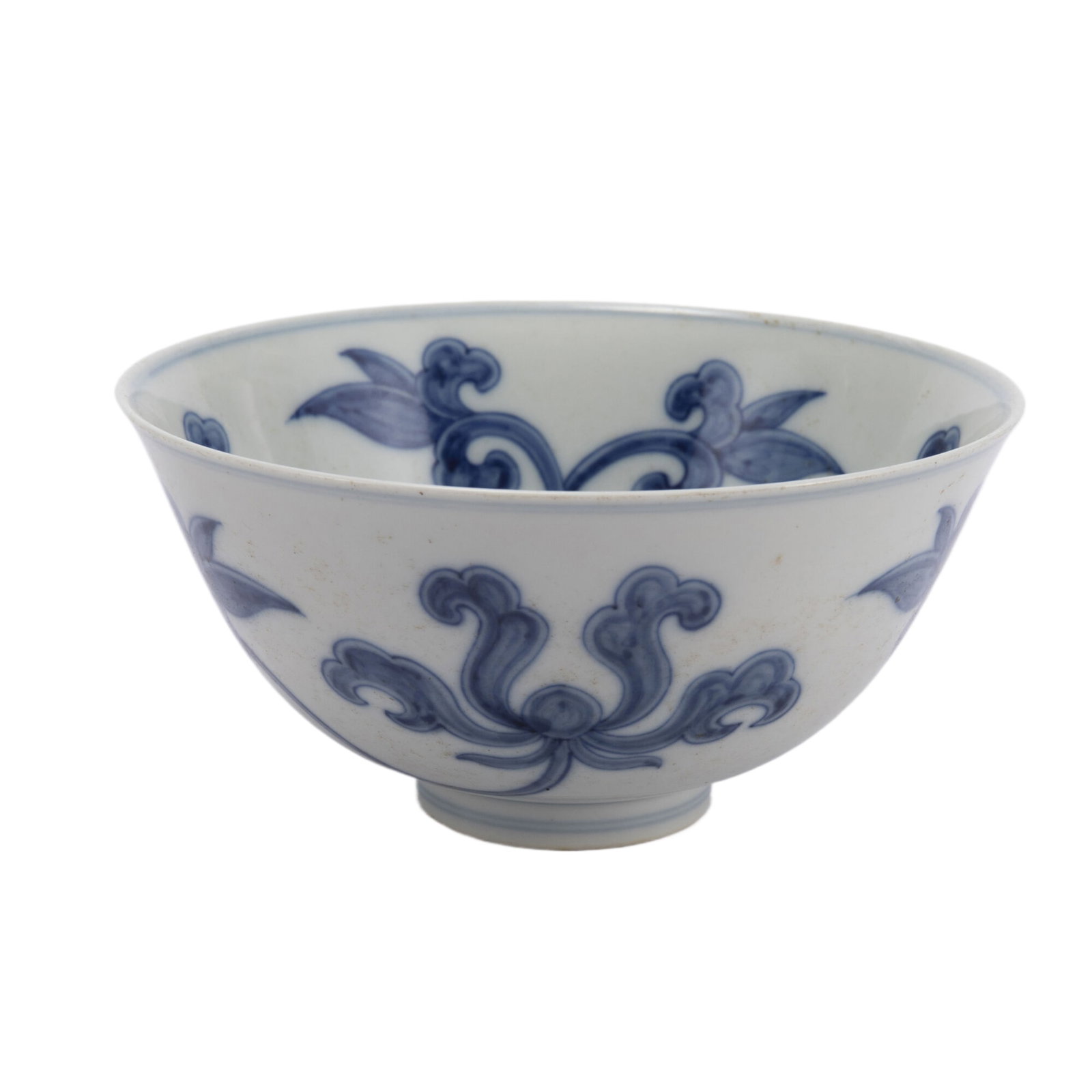 A CHINESE BLUE AND WHITE PORCELAIN BOWL: A CHINESE BLUE AND WHITE PORCELAIN BOWL The deep rounded sides rising from a slightly tapered foot to a circular rim, painted leafy tendrils at the both interior and exterior. DIMENSIONS: Caliber. 15.