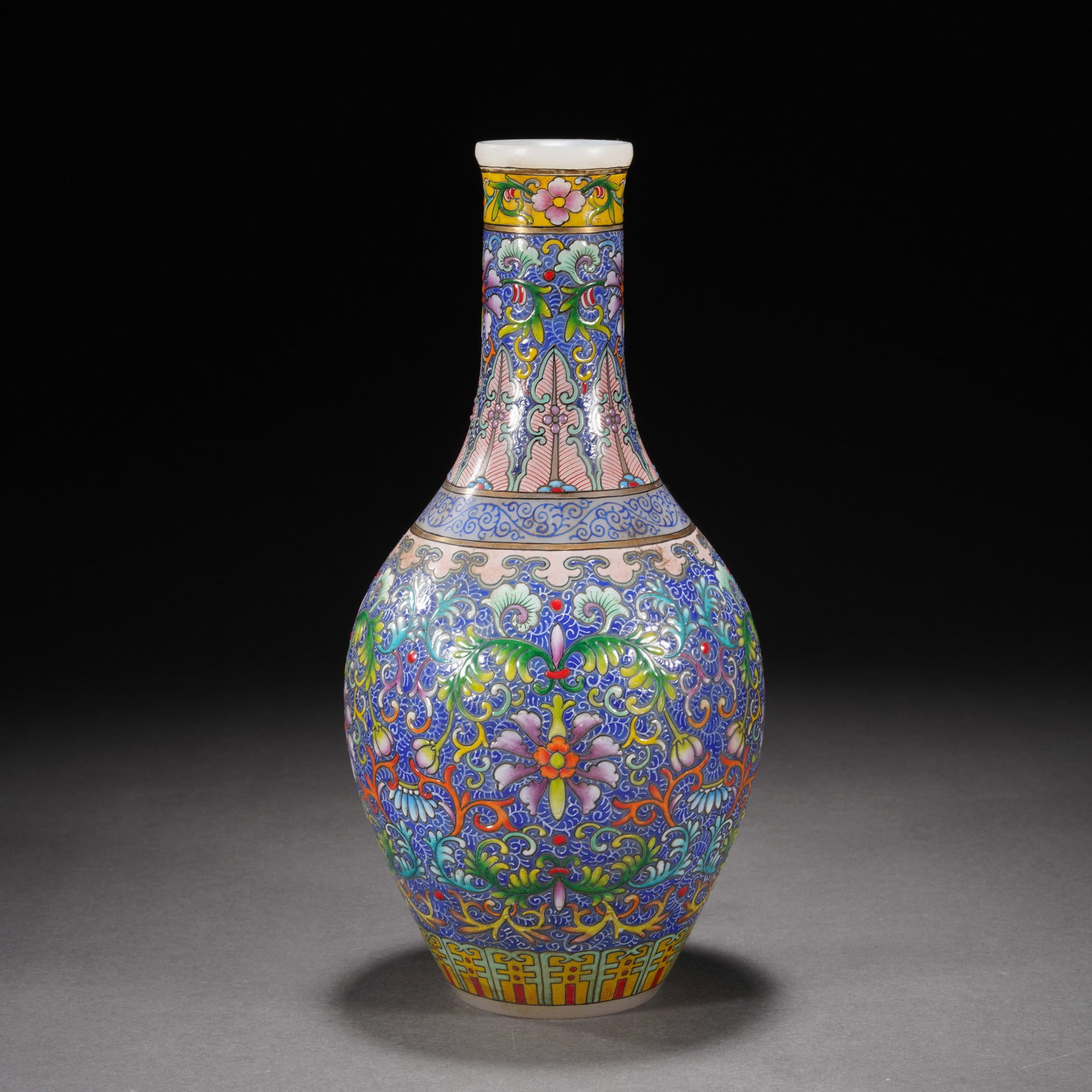 A CHINESE FAMILLE ROSE LOTUS SCROLLS VASE: A CHINESE FAMILLE ROSE LOTUS SCROLLS VASE Of baluster shape, the exterior decorated with floral scrolls in famille rose glaze. DIMENSIONS: 9.5x20 cm. Weight 413 grams. HAVE A SIMILAR ITEM TO SELL? CON