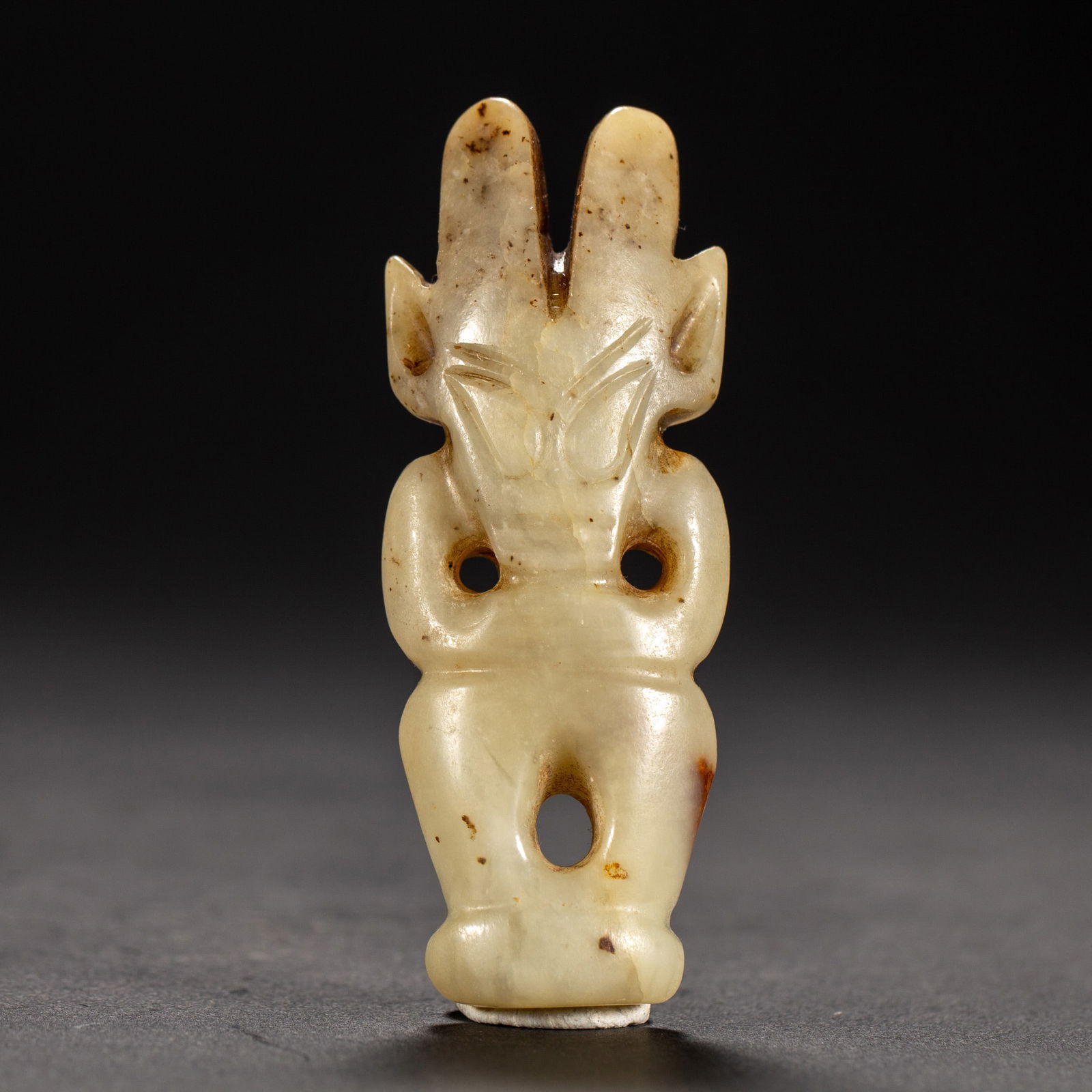 A JADE CARVING OF MYTHICAL FIGURE: A JADE CARVING OF MYTHICAL FIGURE The stone is of warm white tone with russet skins. DIMENSIONS: L. 3.5 cm. W. 1.5 cm. H. 8.5 cm. Weight 60 grams. HAVE A SIMILAR ITEM TO SELL? CONTACT: INFO@GORDONGALL