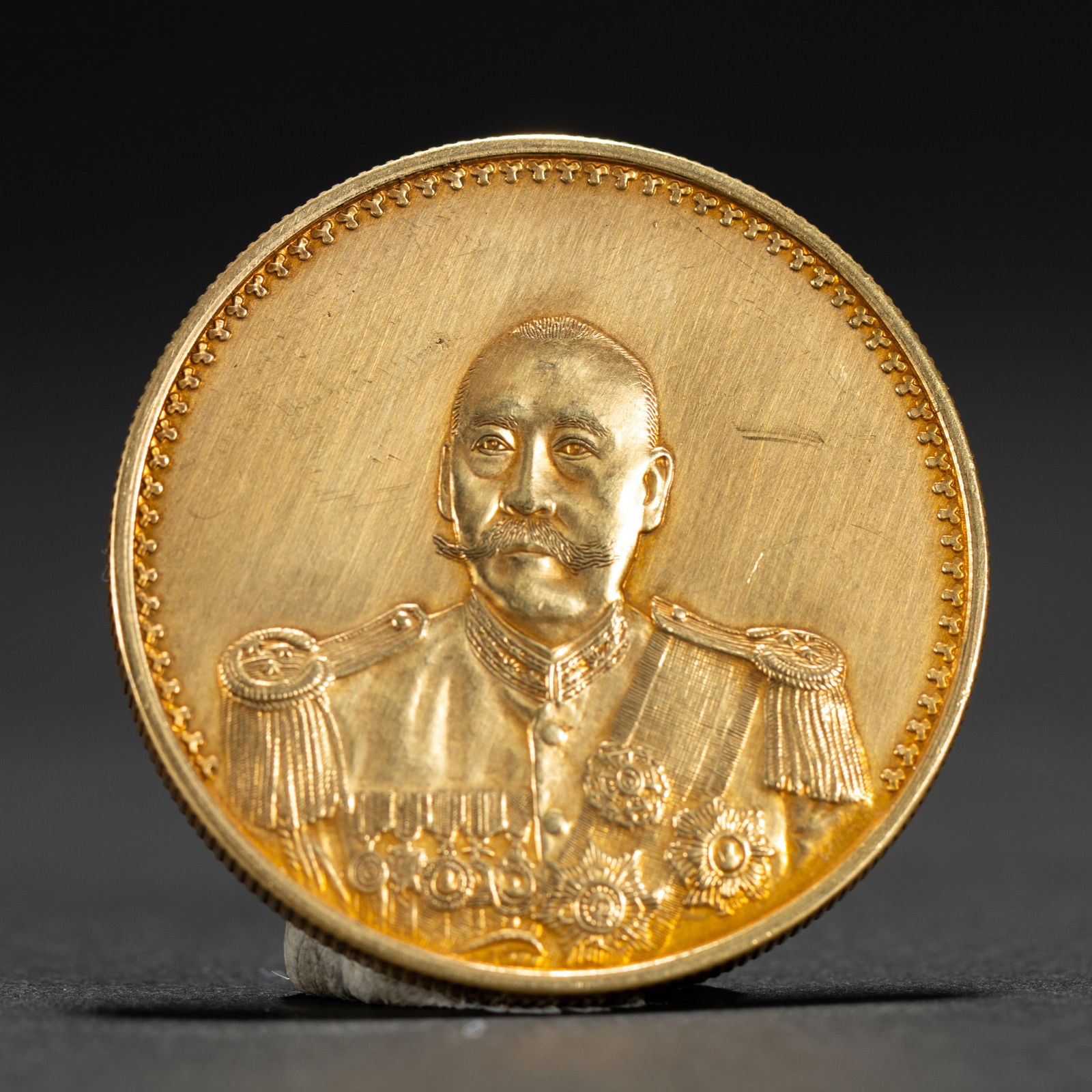 A CHINESE SILVER-GILT COIN (1 of 6)
