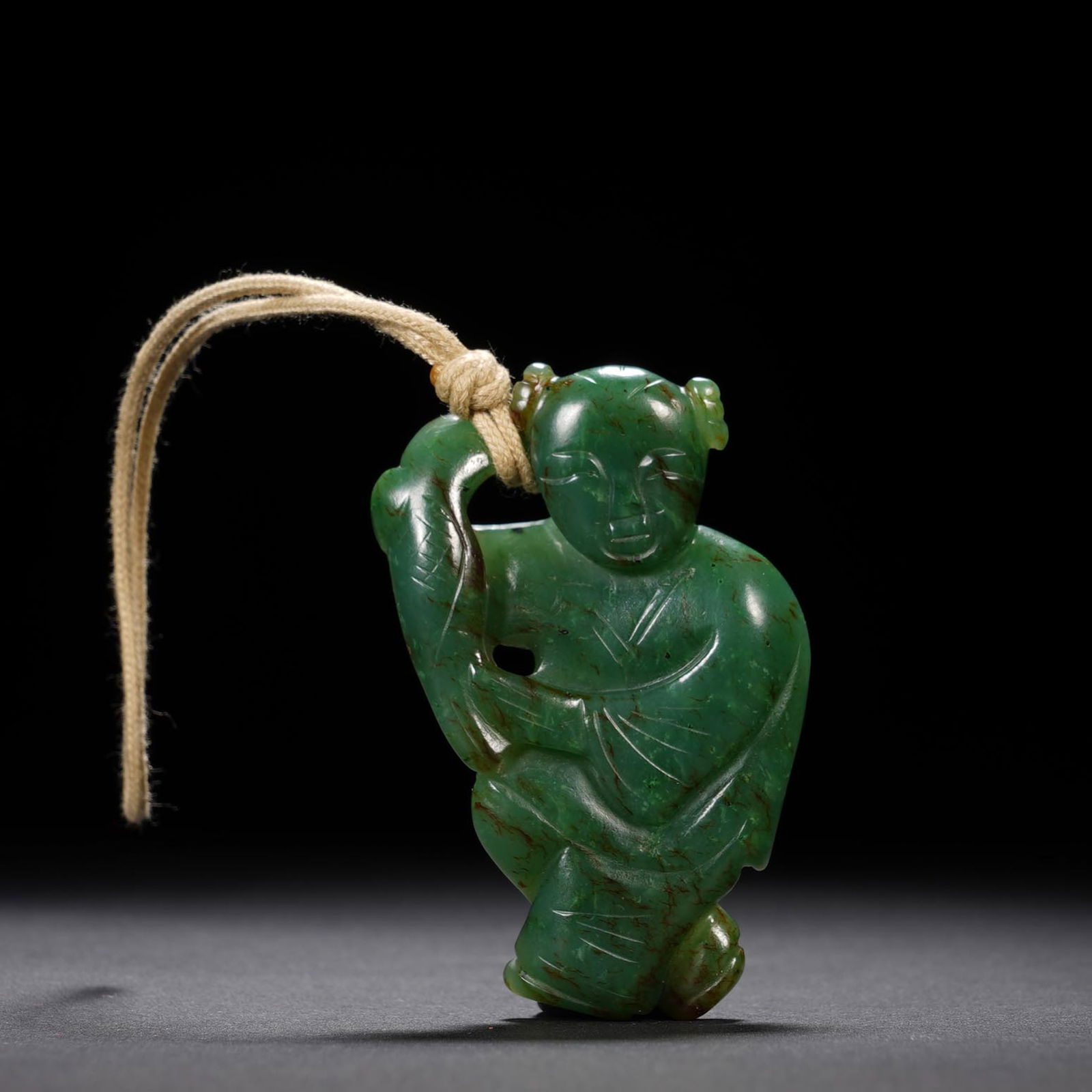 A CARVED SPINACH GREEN JADE BOY (1 of 7)