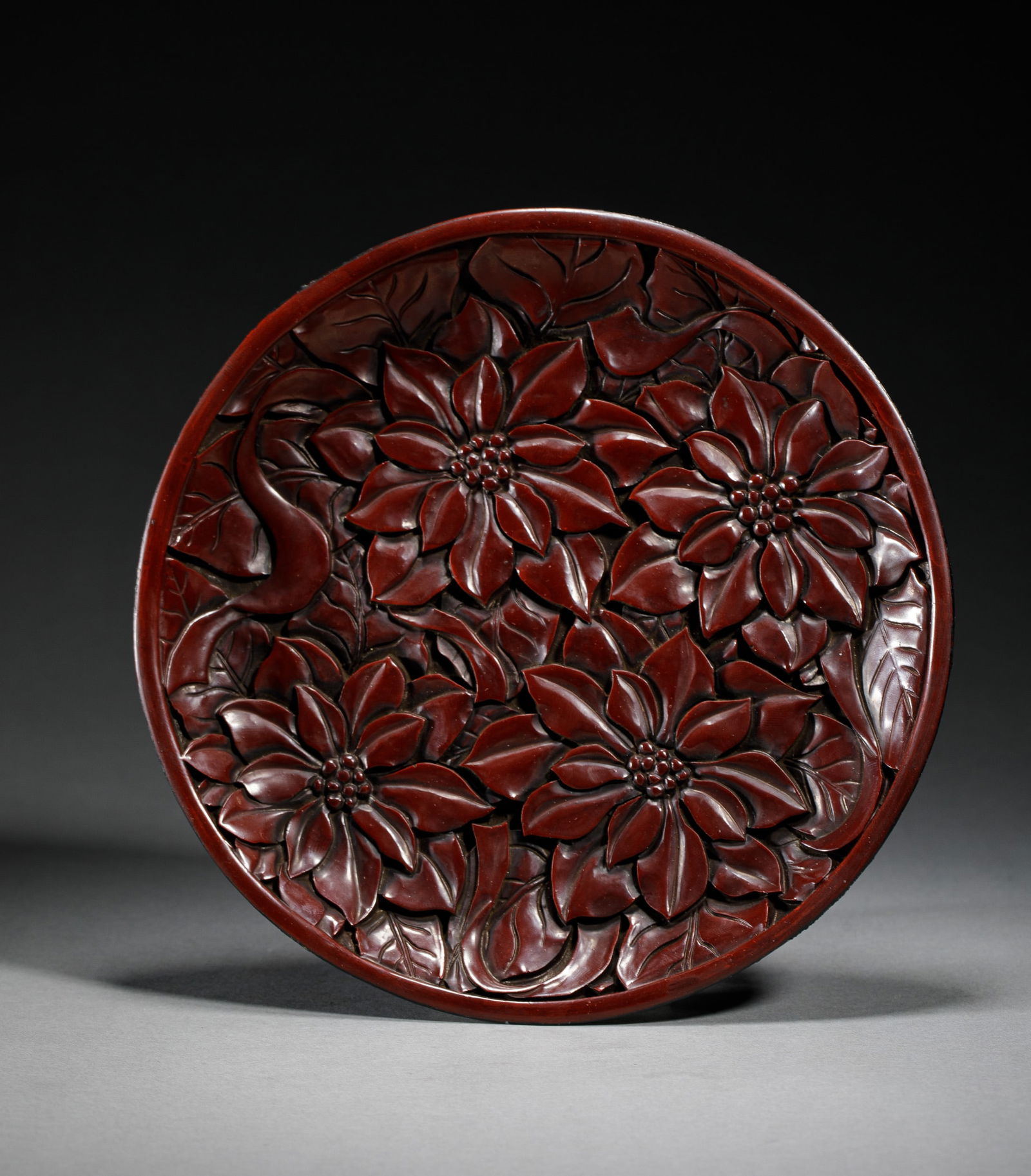 A CARVED CINNABAR LACQUER PLATE (1 of 9)