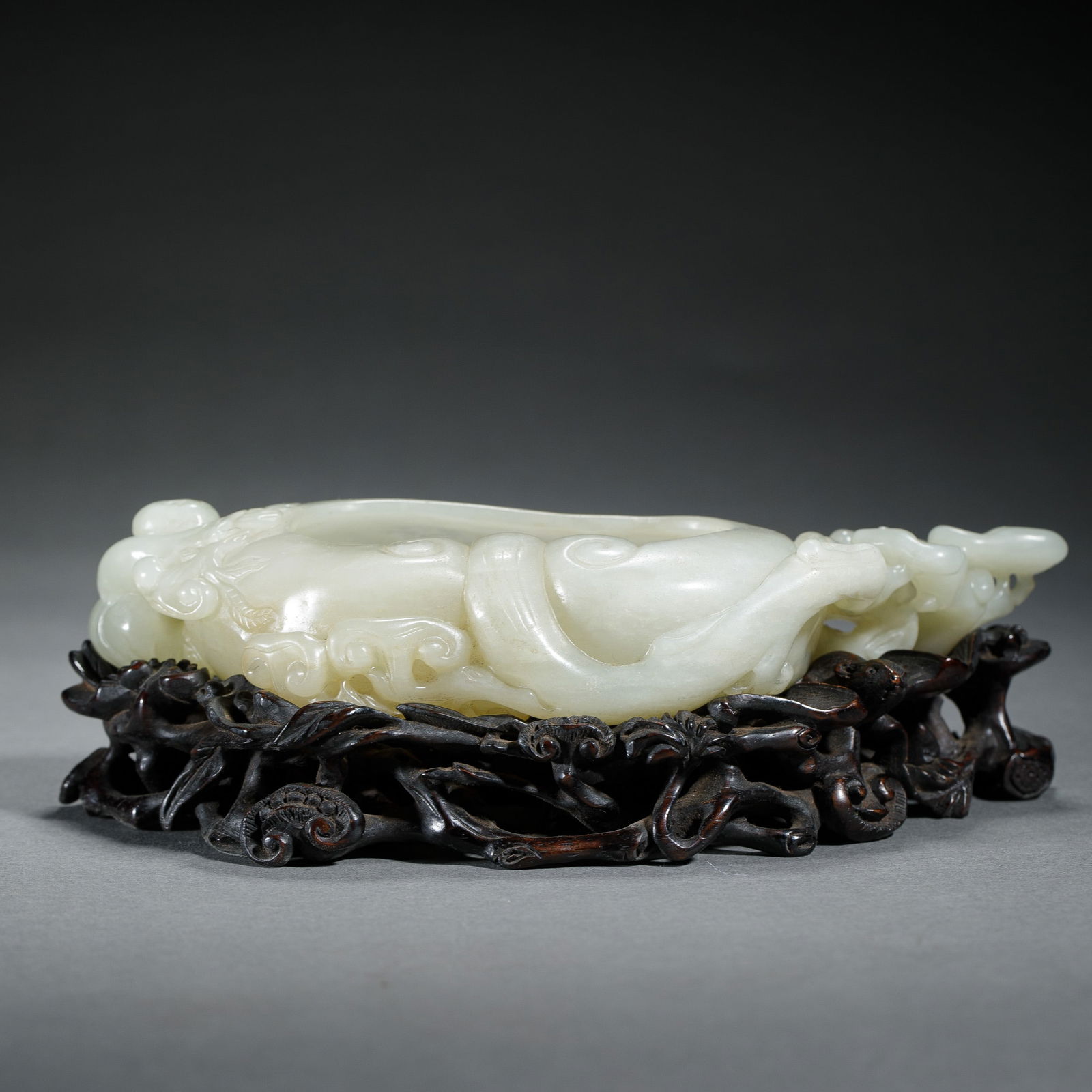 A CARVED WHITE JADE WASHER