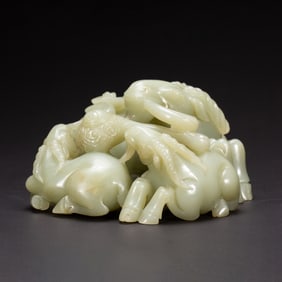 A CARVED JADE RAMS GROUP