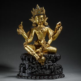 A BRONZE-GILT SEATED VASUDHARA