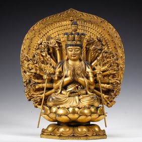 A BRONZE-GILT SEATED AVALOKITESVARA