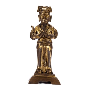 A BRONZE-GILT STANDING GUANPING