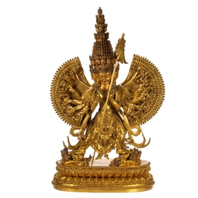 A BRONZE-GILT MULTI-ARM AVALOKITESVARA