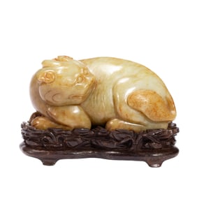 A CARVED JADE MYTHICAL BEAST